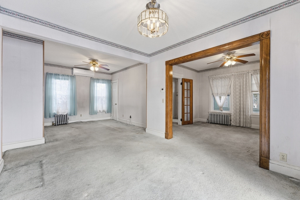 60 Barrison Street Springfield, MA 01109 - Photo 7 of 25 a view of a hallway with chandelier