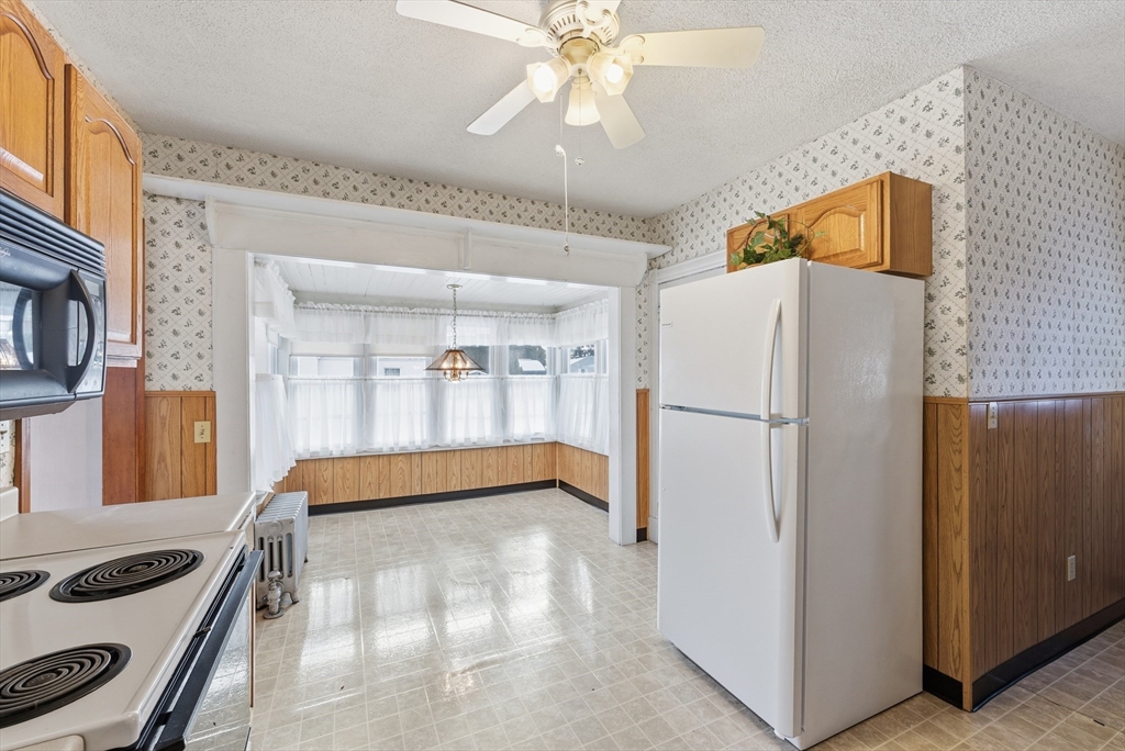 60 Barrison Street Springfield, MA 01109 - Photo 9 of 25 a kitchen with a refrigerator and a sink