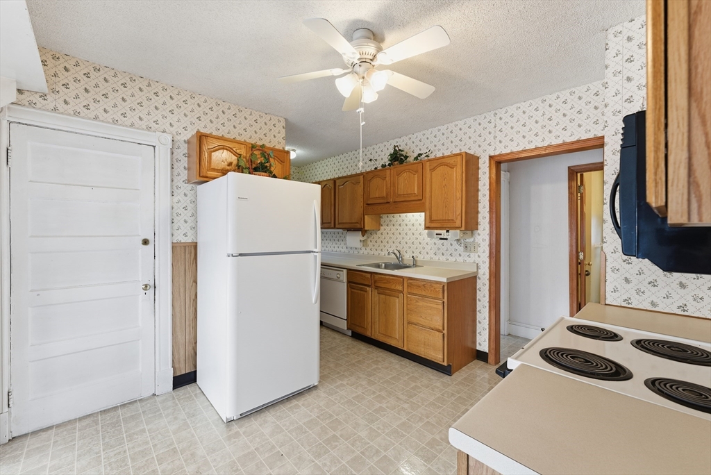60 Barrison Street Springfield, MA 01109 - Photo 10 of 25 a kitchen with a refrigerator and a stove