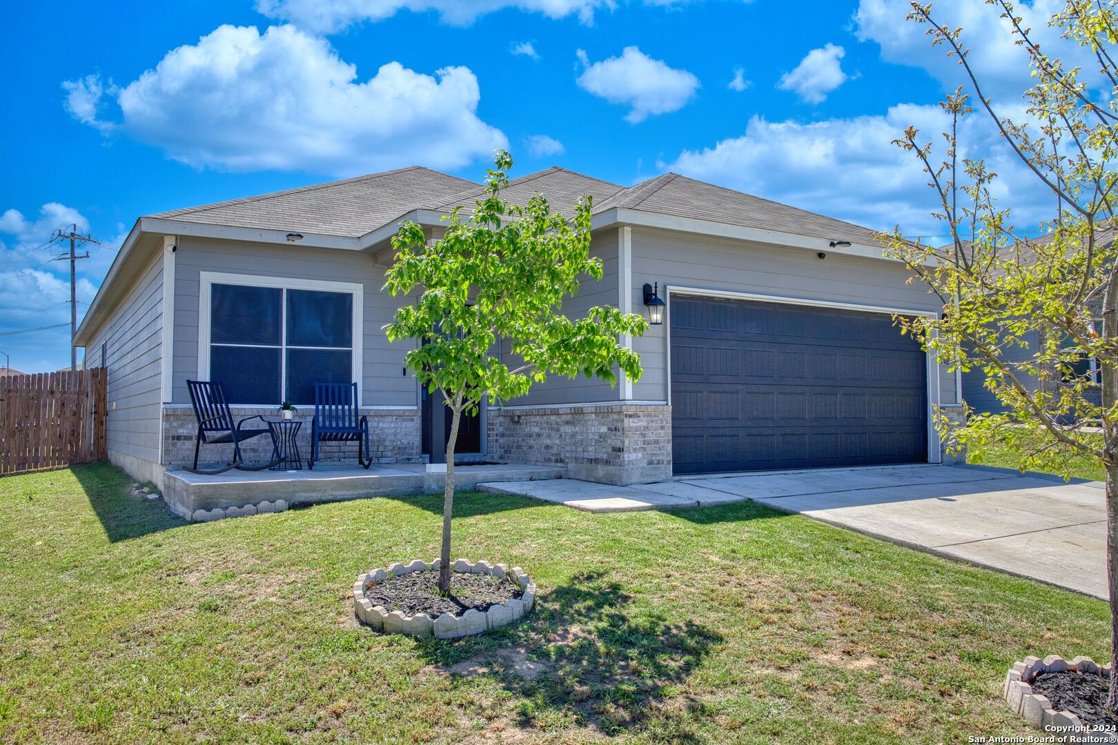 7104 Quarter Moon Converse, TX 78109 - Photo 2 of 28 a front view of a house with a yard