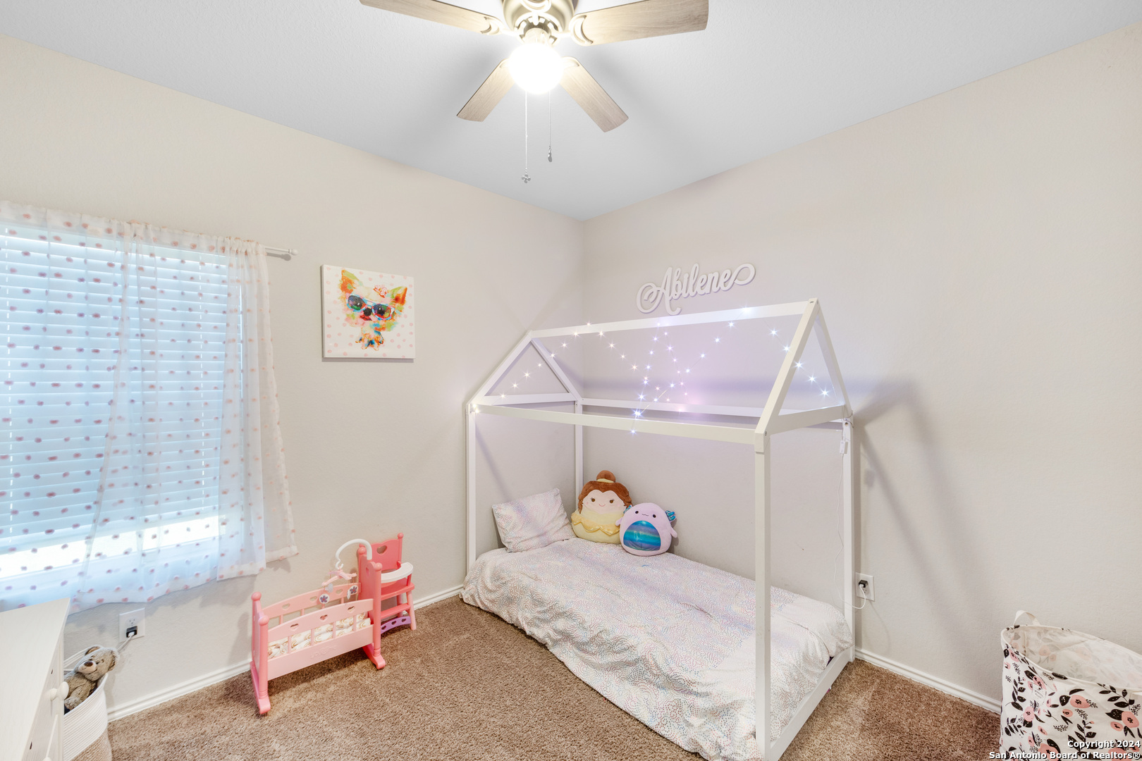 7104 Quarter Moon Converse, TX 78109 - Photo 23 of 28 a bedroom with a bed and a window