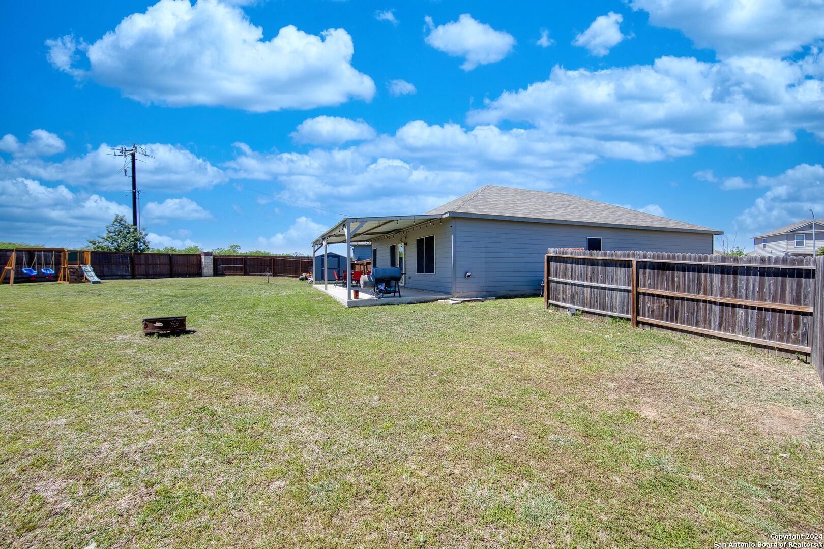 7104 Quarter Moon Converse, TX 78109 - Photo 6 of 28 a view of a house with a backyard