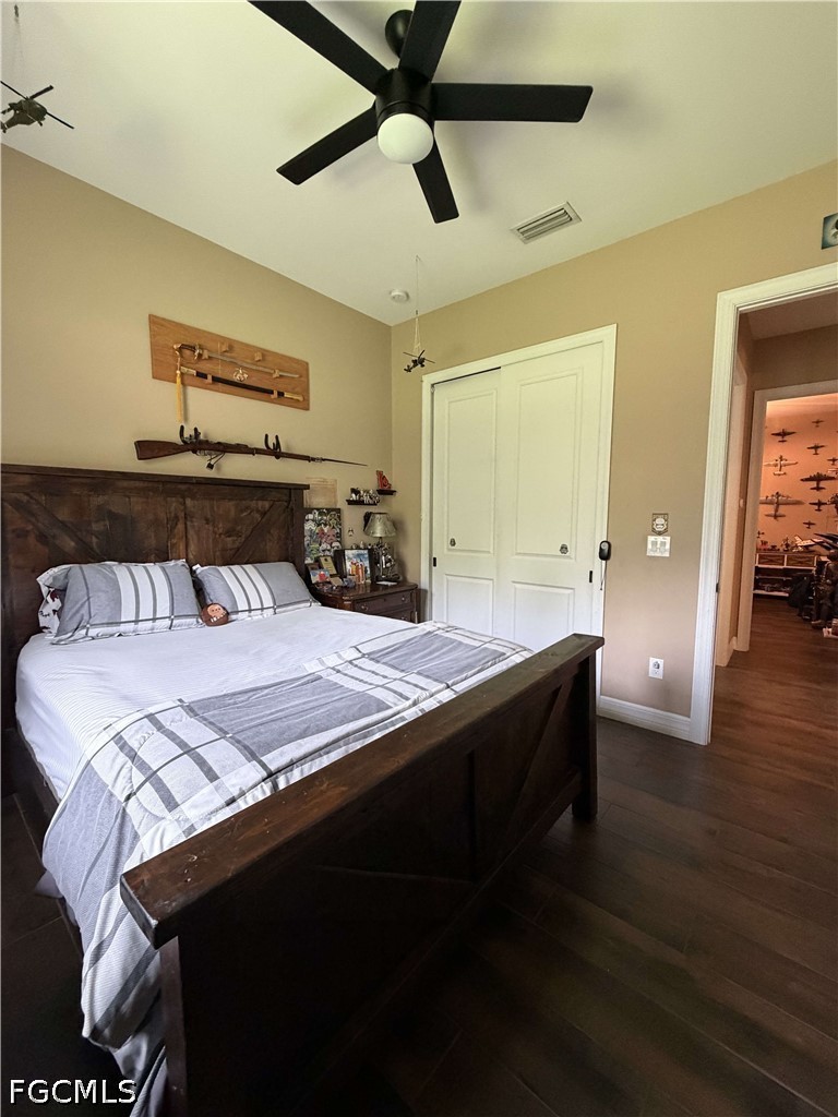 190 2nd Street Southeast Naples, FL 34117 - Photo 16 of 47 a bedroom with a bed and wooden floor
