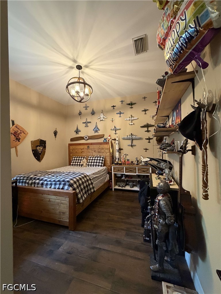 190 2nd Street Southeast Naples, FL 34117 - Photo 19 of 47 a spacious bedroom with a bed and a chandelier