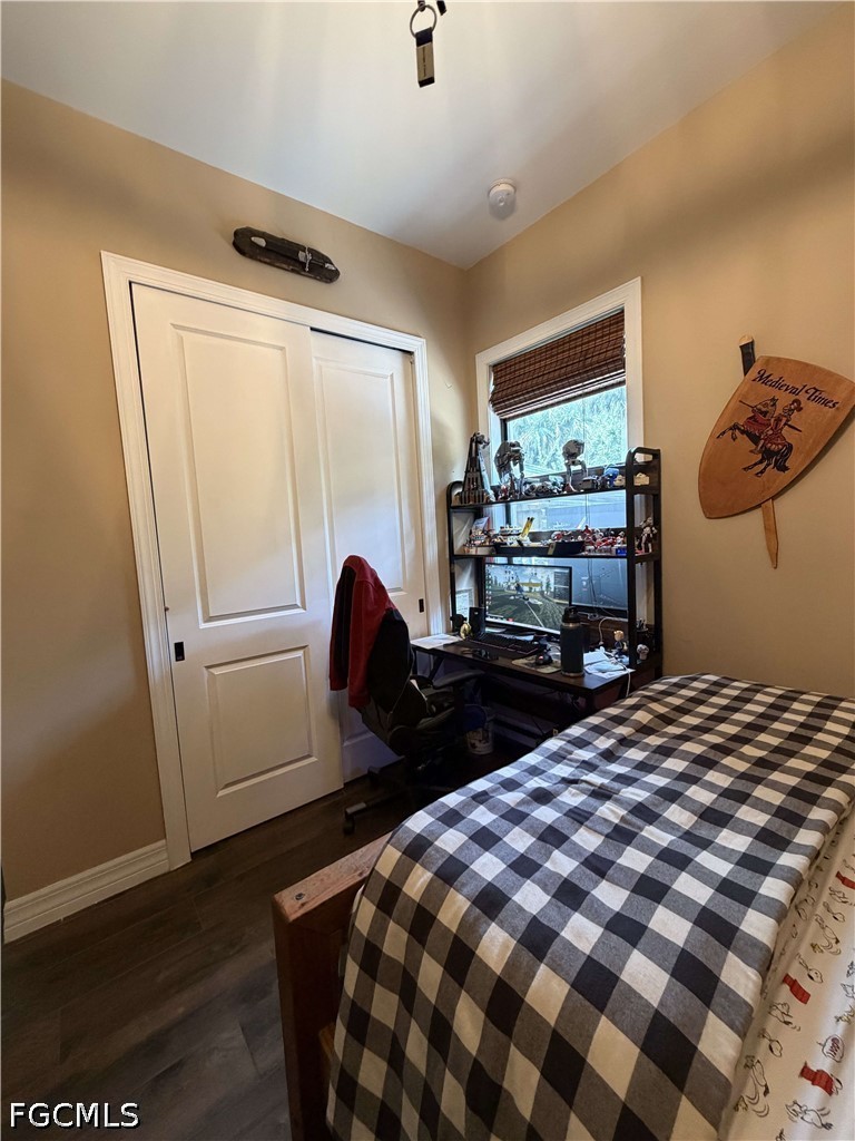 190 2nd Street Southeast Naples, FL 34117 - Photo 21 of 47 a bedroom with a bed and wooden floor