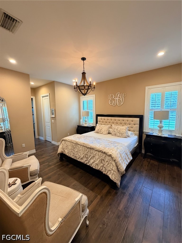 190 2nd Street Southeast Naples, FL 34117 - Photo 23 of 47 a bedroom with a bed and wooden floor
