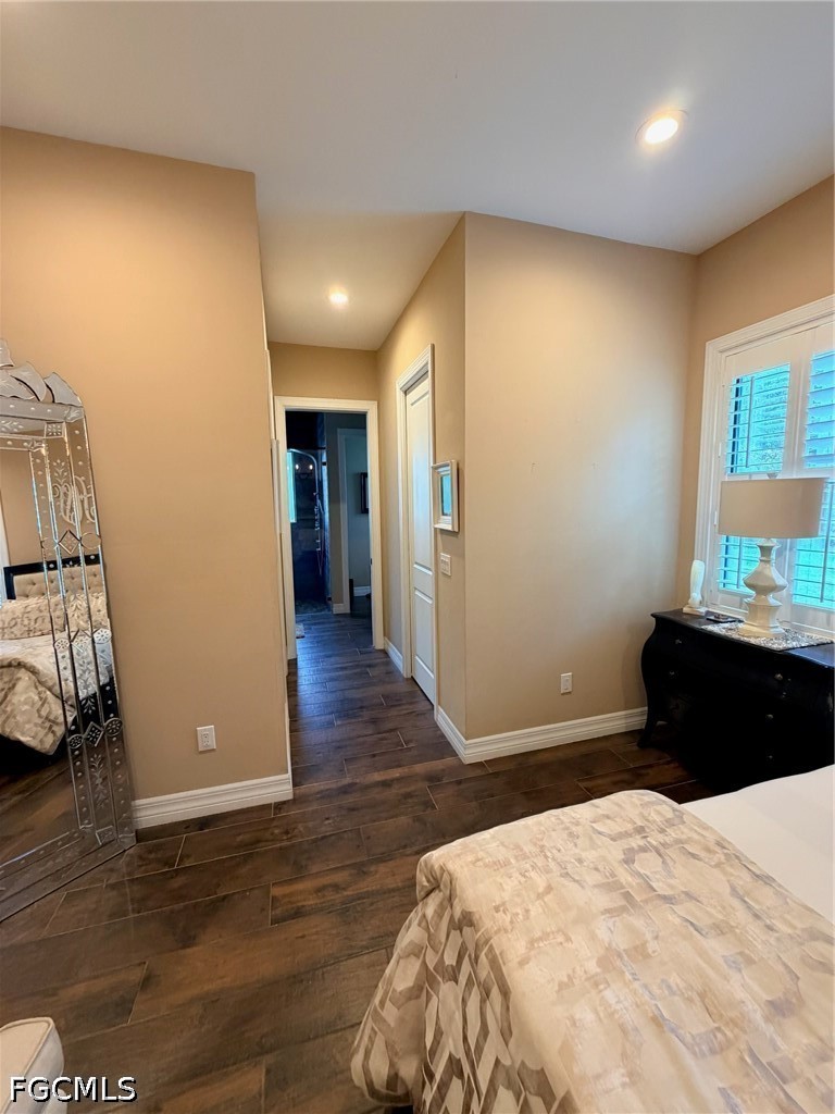 190 2nd Street Southeast Naples, FL 34117 - Photo 25 of 47 a bedroom with a bed and wooden floor