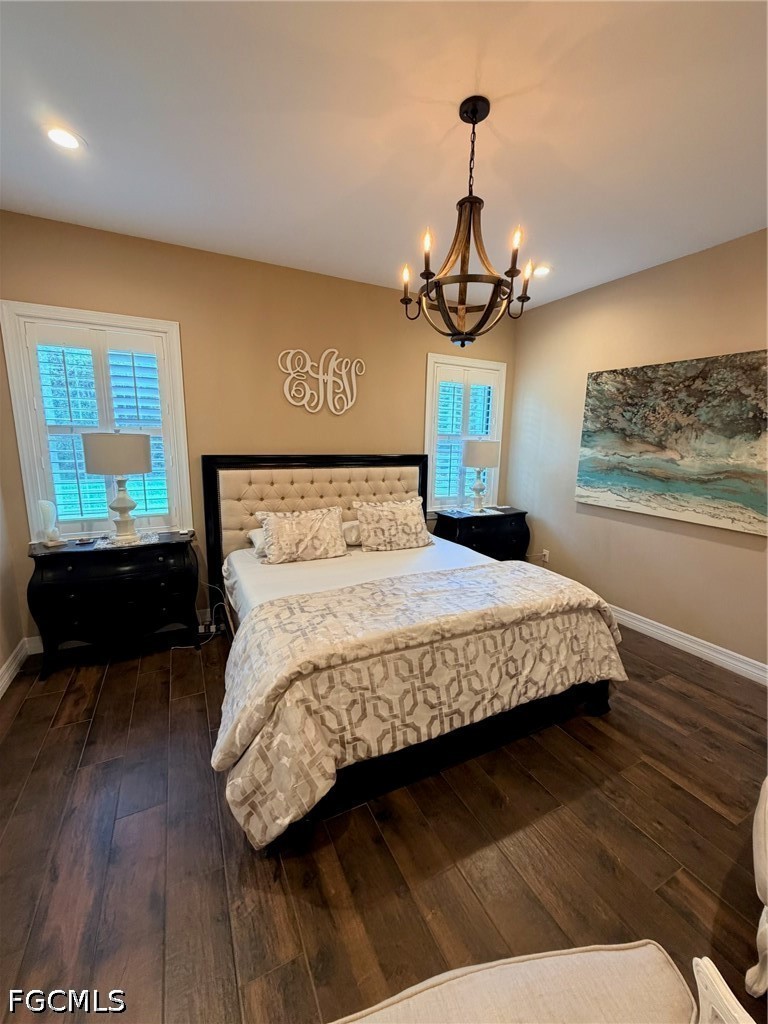 190 2nd Street Southeast Naples, FL 34117 - Photo 27 of 47 a bedroom with a bed and wooden floor