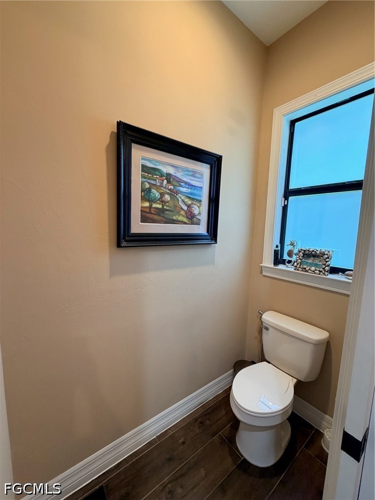 190 2nd Street Southeast Naples, FL 34117 - Photo 32 of 47 a white toilet sitting next to a small bathroom