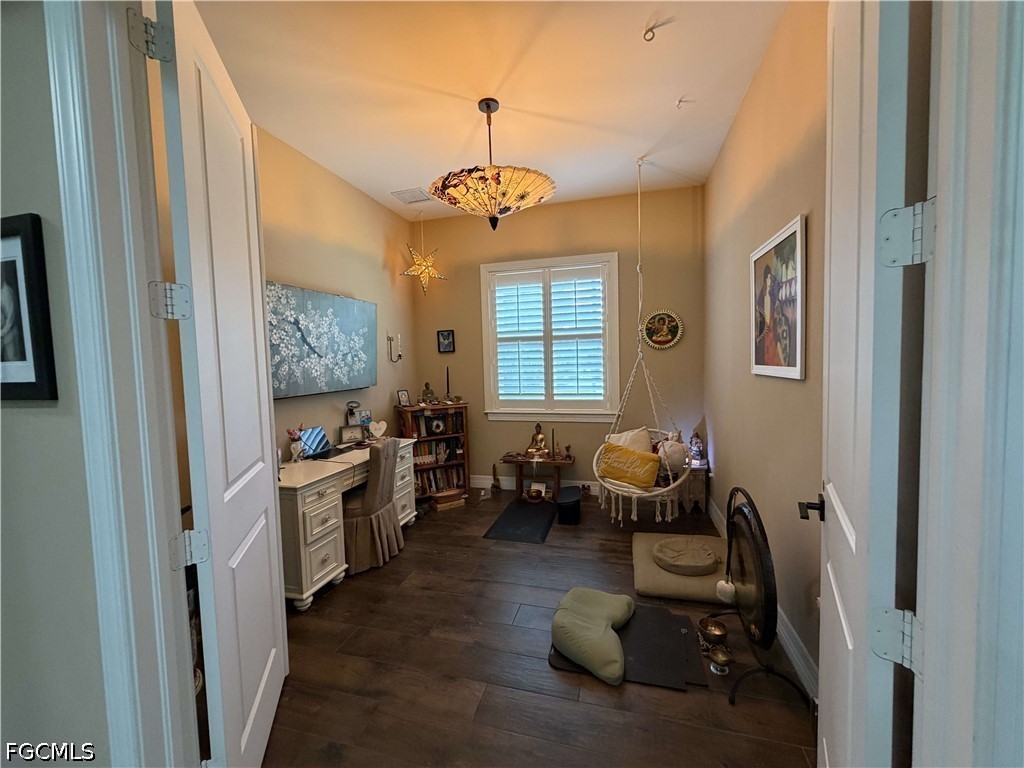 190 2nd Street Southeast Naples, FL 34117 - Photo 37 of 47 a living room with furniture two window and a chandelier