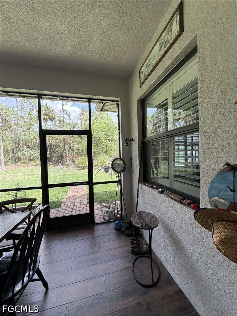 190 2nd Street Southeast Naples, FL 34117 - Photo 40 of 47 a living room with furniture and a large window