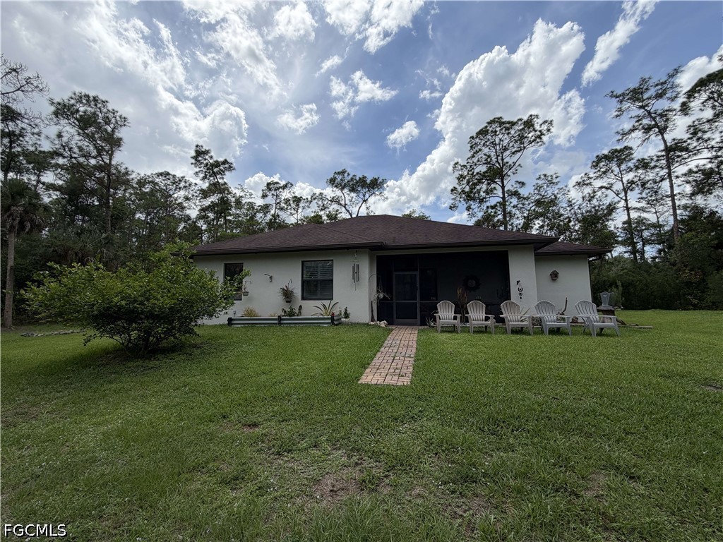 190 2nd Street Southeast Naples, FL 34117 - Photo 44 of 47 a view of a house with a back yard