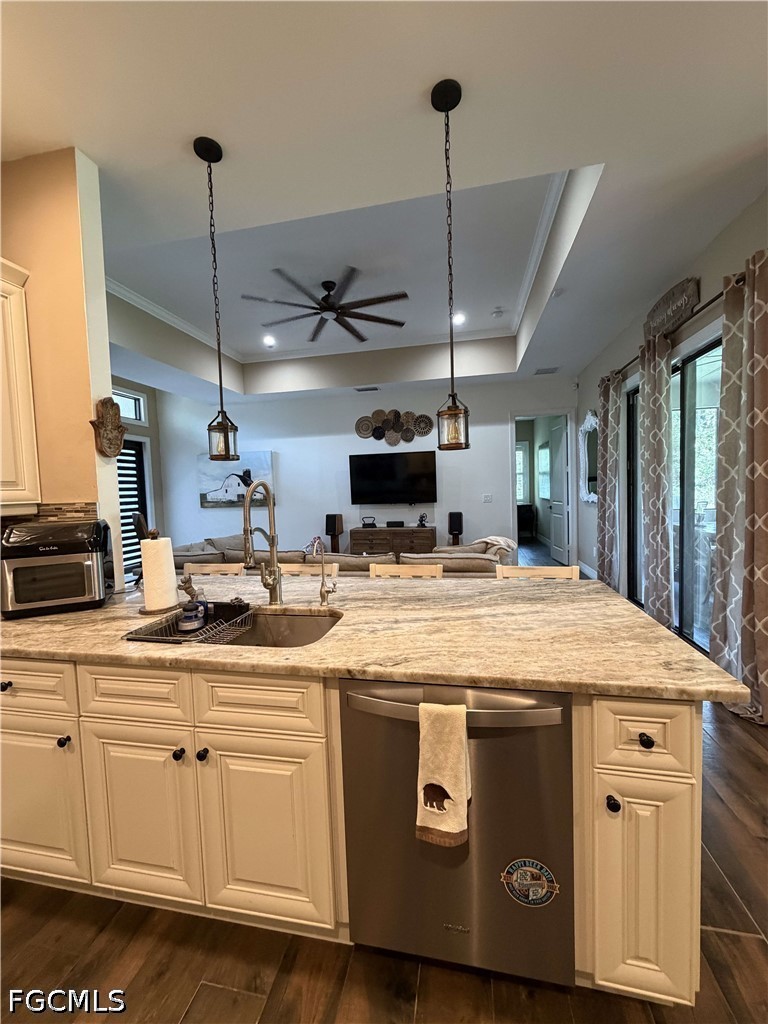 190 2nd Street Southeast Naples, FL 34117 - Photo 10 of 47 a kitchen with stainless steel appliances granite countertop a sink a stove and a wooden floors