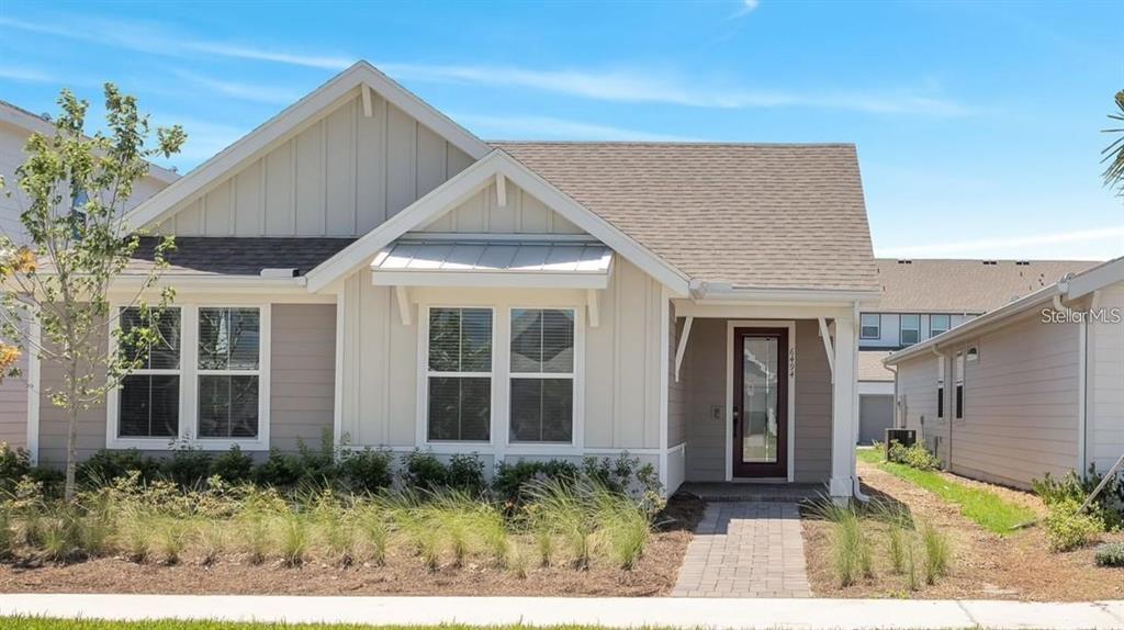 6494 Rover Way St. Cloud, FL 34771 - Photo 1 of 50 a front view of a house with a yard
