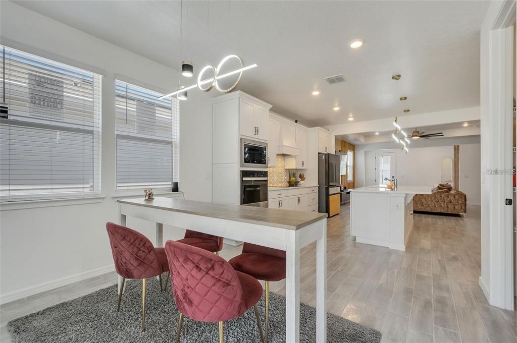 6494 Rover Way St. Cloud, FL 34771 - Photo 16 of 50 a large white kitchen with a large window