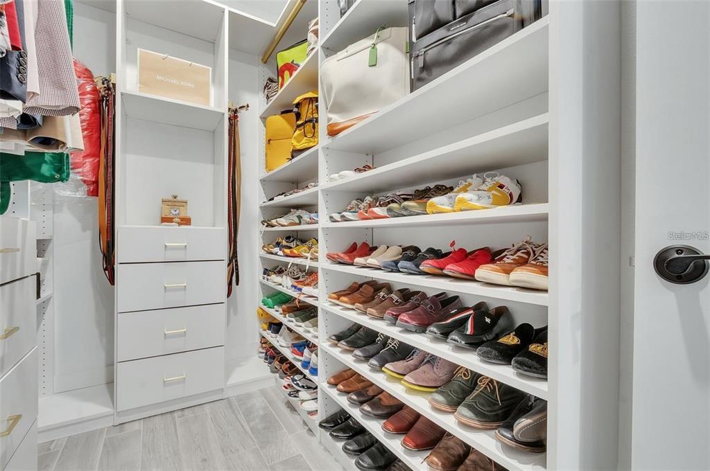 6494 Rover Way St. Cloud, FL 34771 - Photo 19 of 50 a view of walk in closet with clothes and shoes