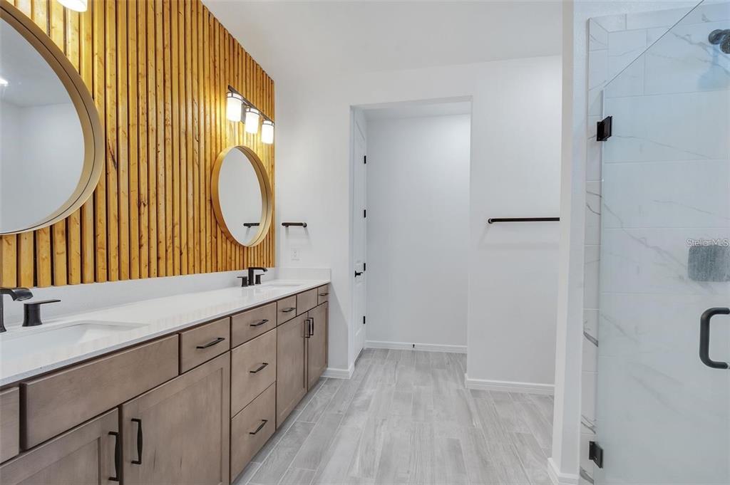 6494 Rover Way St. Cloud, FL 34771 - Photo 21 of 50 a bathroom with a sink and a mirror