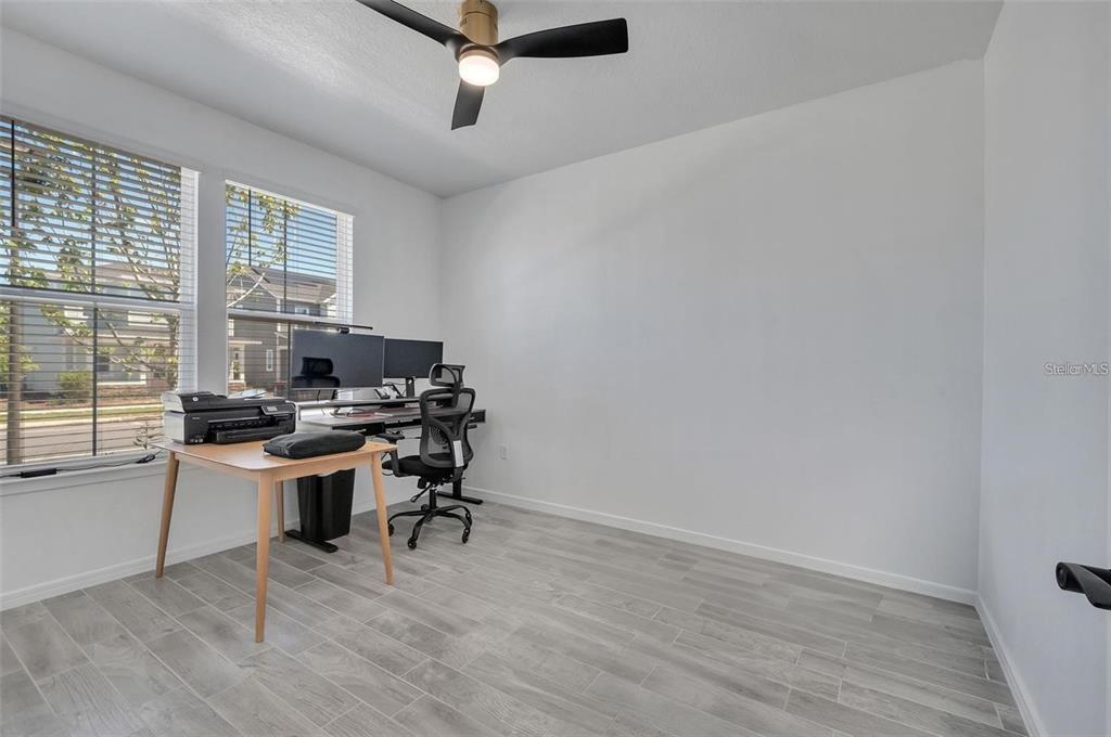 6494 Rover Way St. Cloud, FL 34771 - Photo 24 of 50 a view of a workspace with furniture and a window