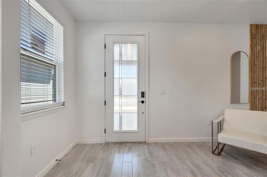 6494 Rover Way St. Cloud, FL 34771 - Photo 3 of 50 an empty room with a window and wooden floor