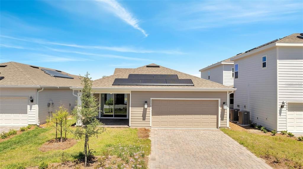 6494 Rover Way St. Cloud, FL 34771 - Photo 39 of 50 a front view of a house with a yard