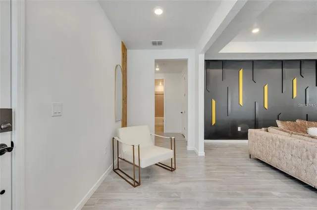 a living room with a bed and furniture