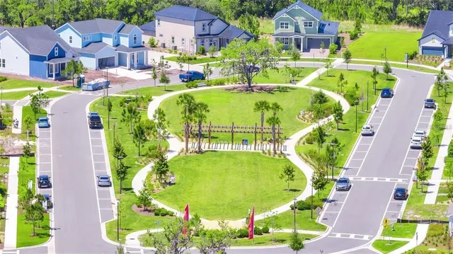 an aerial view of a house with a swimming pool