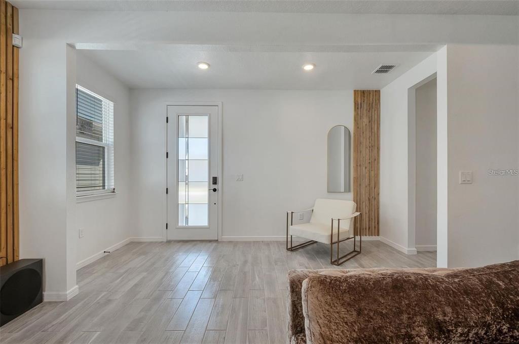 6494 Rover Way St. Cloud, FL 34771 - Photo 5 of 50 a bedroom with a bed and wooden floor