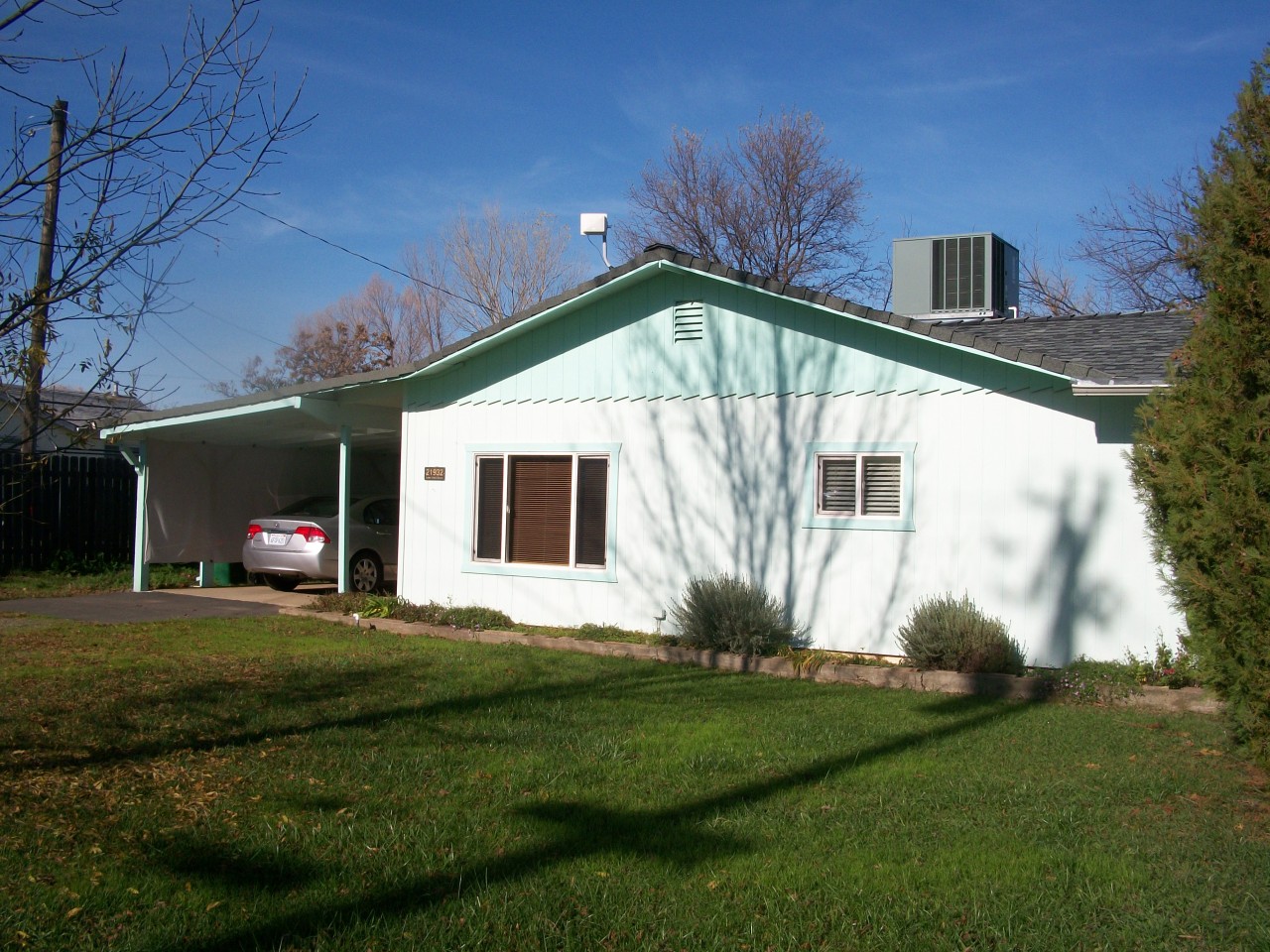 21932 Lone Tree Road Anderson, CA 96007 - Photo 1 of 26 a front view of a house with a yard