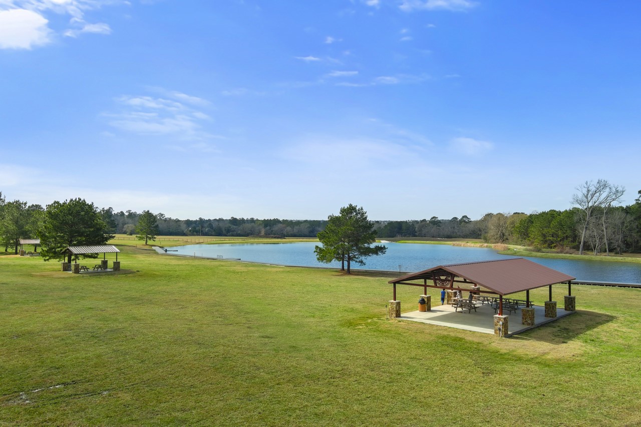 10751 Ruger Road Willis, TX 77378 - Photo 19 of 22 A 37-acre park includes a 7-acre stocked pond.