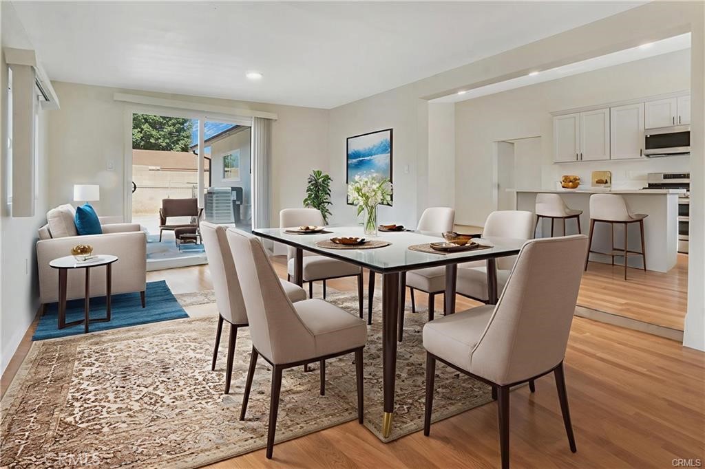 1594 Morgan Road San Bernardino, CA 92407 - Photo 23 of 31 a view of a dining room with furniture window and wooden floor