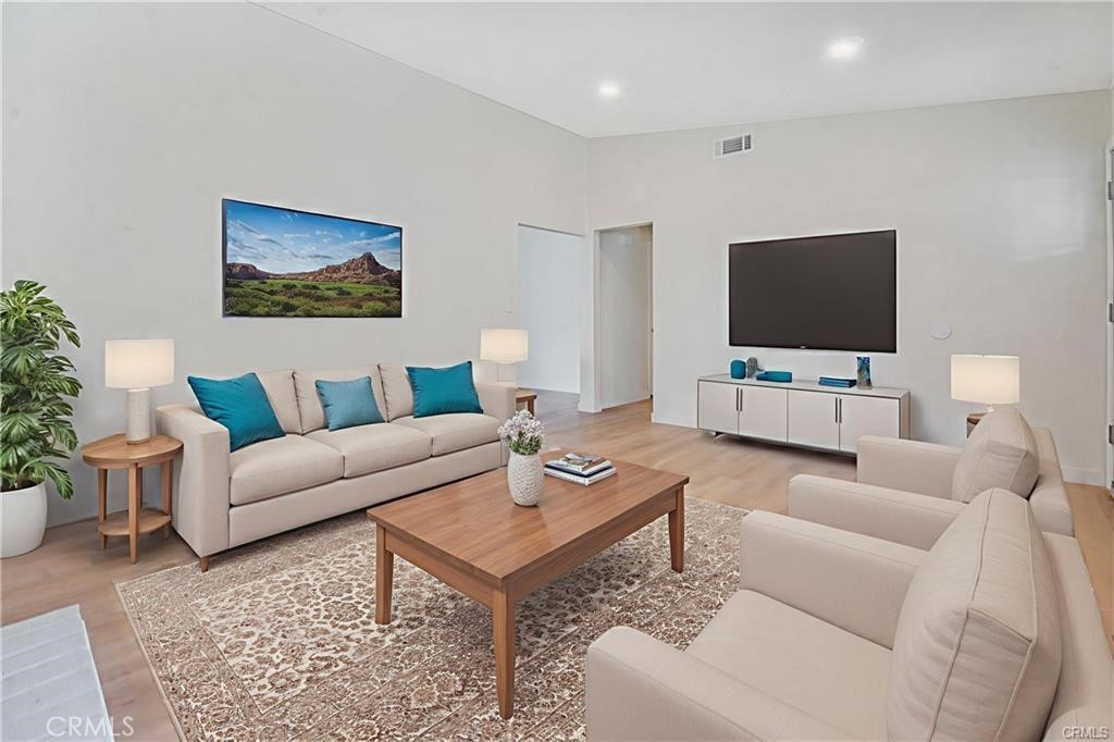 1594 Morgan Road San Bernardino, CA 92407 - Photo 27 of 31 a living room with furniture and a flat screen tv