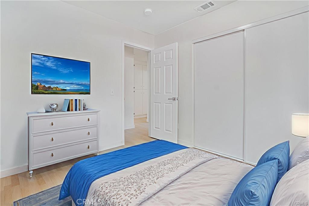 1594 Morgan Road San Bernardino, CA 92407 - Photo 6 of 31 a bedroom with a bed and a dresser