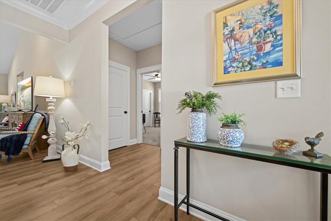 6834 Midway Road Pelzer, SC 29669 - Photo 5 of 50 Bright and airy living spaces welcome you with warm flooring and clean finishes.