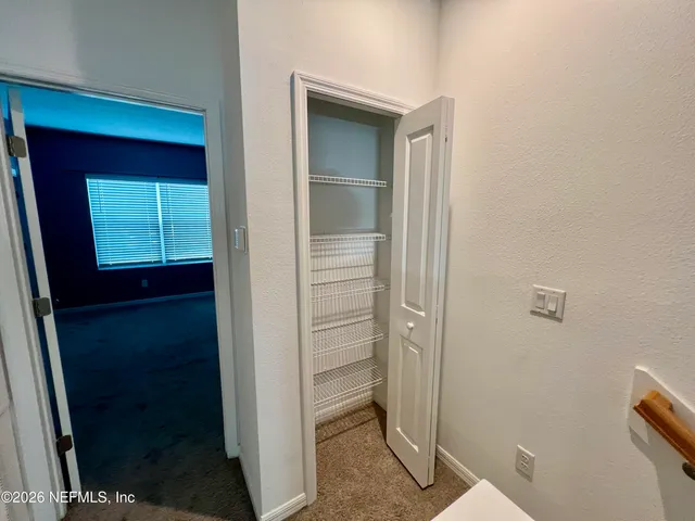 a view of hallway with sink