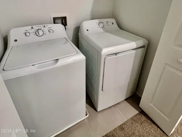 a utility room with dryer and washer