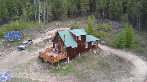 a view of a wooden deck with a yard