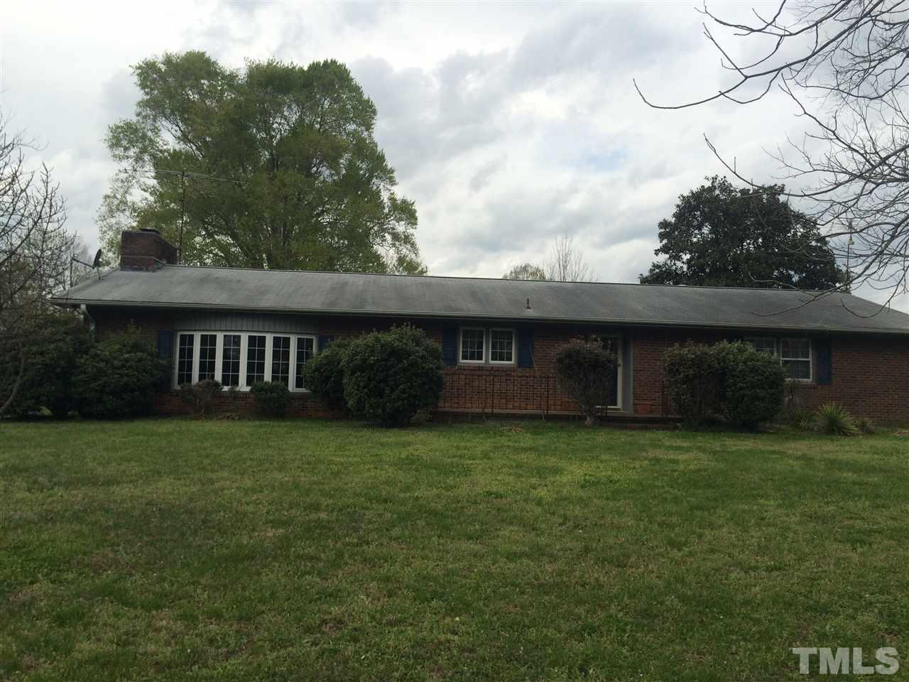 1809 Tilley Farm Road Rougemont, NC 27572 - Photo 1 of 3 a view of a house with a yard