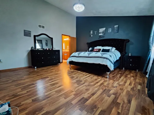 a bedroom with a bed and a closet