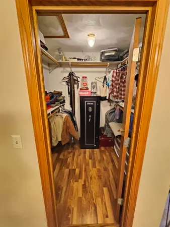 a view of a room with wooden floor