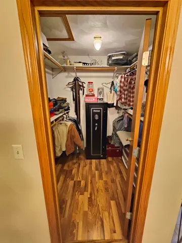 a view of a room with wooden floor