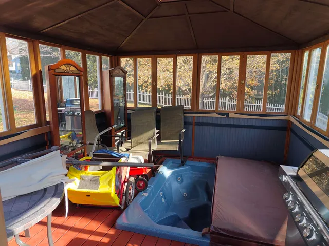 a view of a workspace with furniture and a potted plant