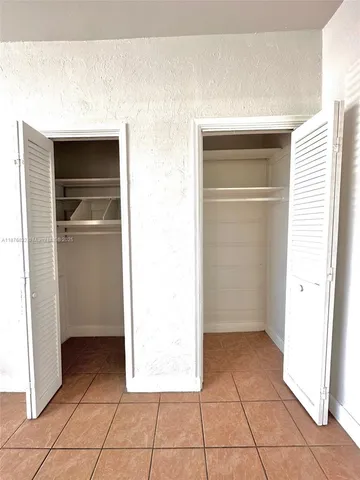 a view of a utility room with closet