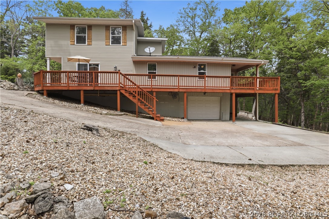 718 West Kays Point Road Lake Ozark, MO 65049 - Photo 35 of 44 Side view of home