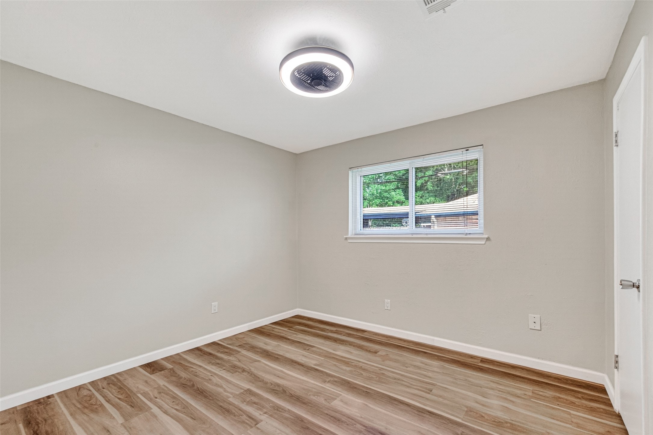 25503 Foxbriar Lane Spring, TX 77373 - Photo 31 of 45 an empty room with wooden floor and windows
