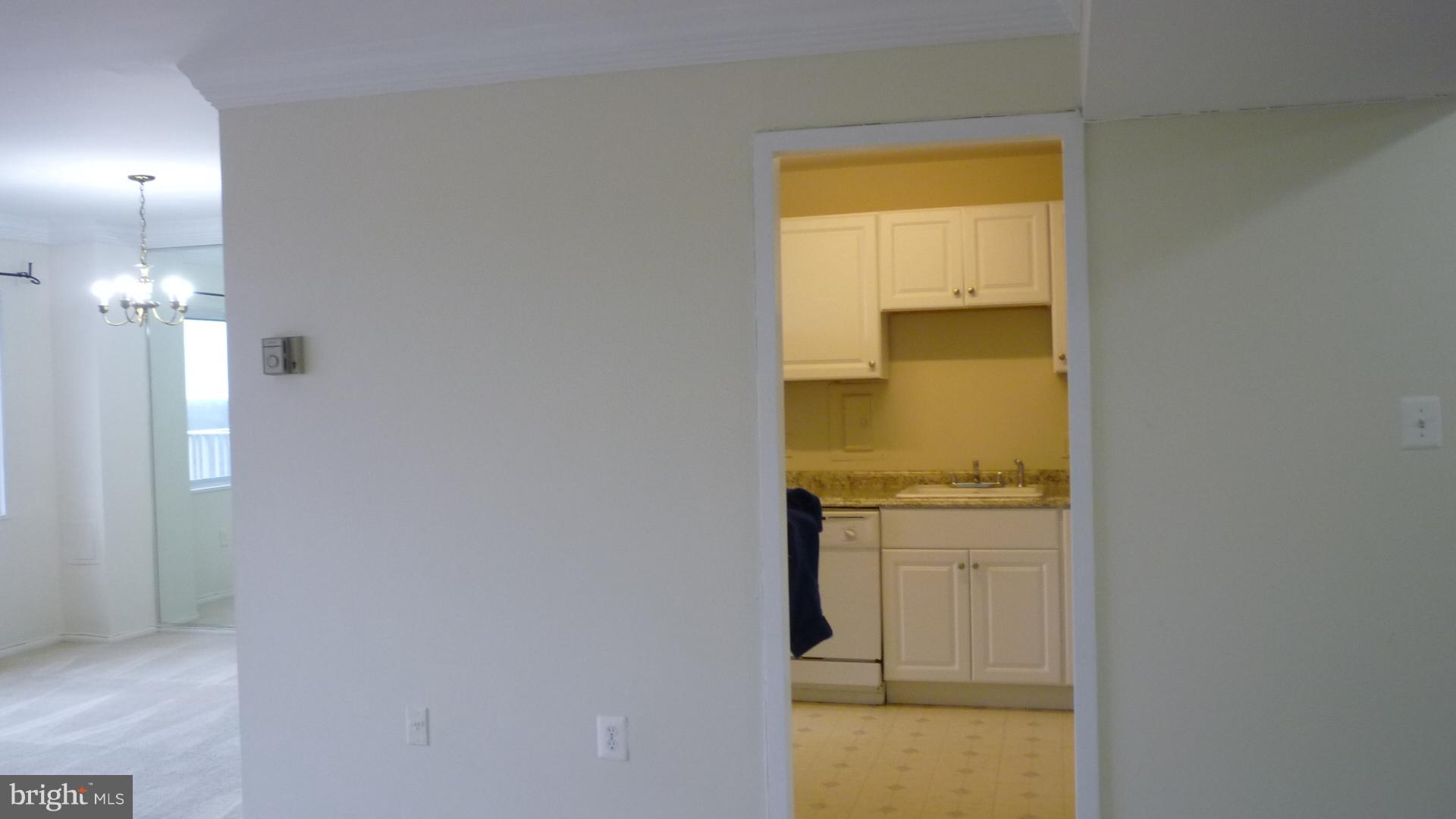 1111 University Boulevard West, Unit 1406A Silver Spring, MD 20902 - Photo 9 of 41 Dining room into Kitchen