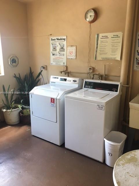 Atlantic Shores Hallandale Beach, FL 33009 - Photo 19 of 19 a utility room with dryer and washer