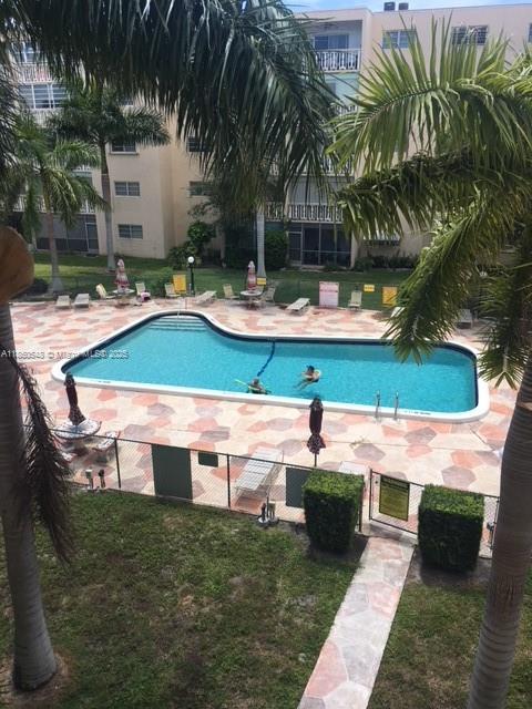 Atlantic Shores Hallandale Beach, FL 33009 - Photo 2 of 19 a swimming pool with outdoor seating and yard