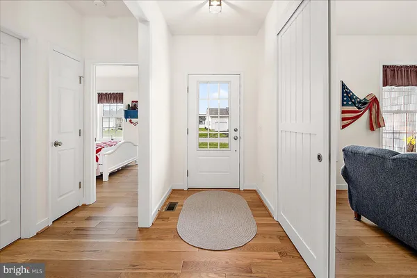 a kitchen with stainless steel appliances a sink stove refrigerator and cabinets