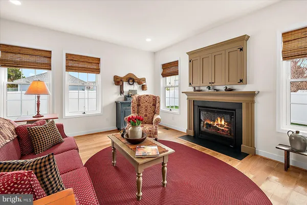a bedroom with furniture and a wooden floor