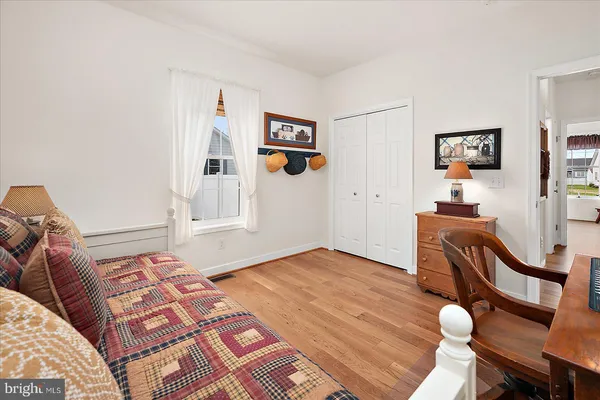 a front view of a house with outdoor seating and plants